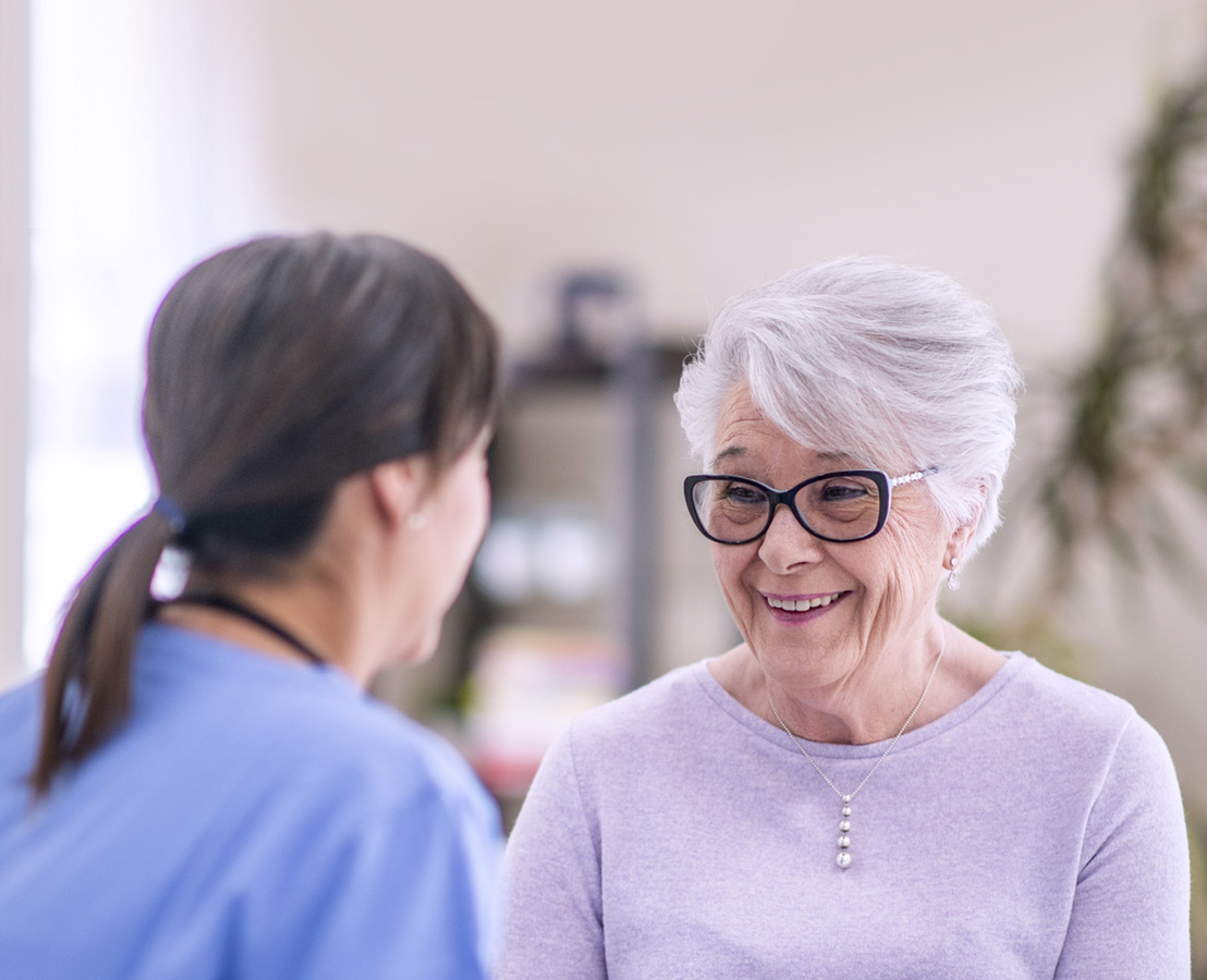 a healthcare professional talking to a patient