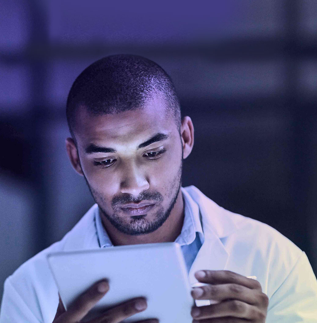 a man looking at an iPad